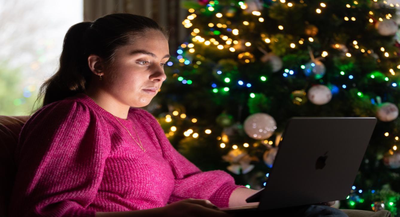 Avril Griffen O Shea shopping online on laptop on christmas tree cyber security courses