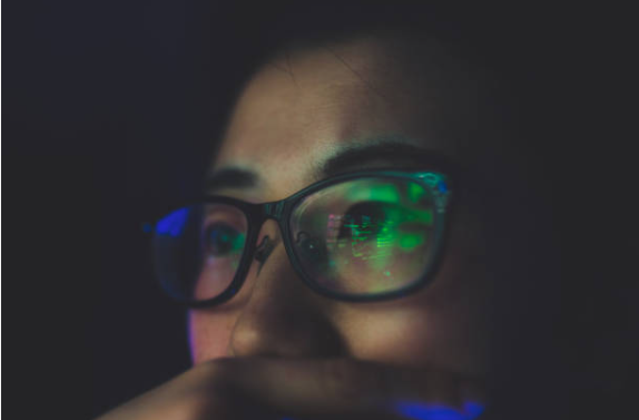Women looking at screen of cyber security courses